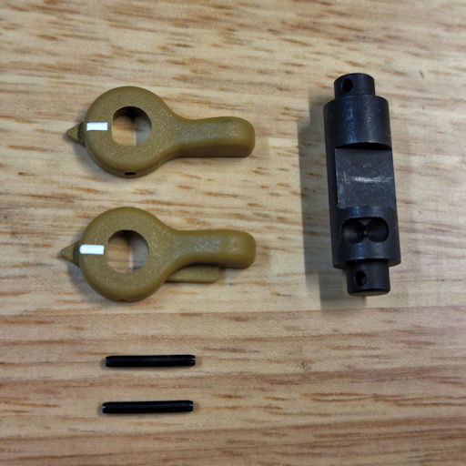 All the parts necessary to assemble the HK safety selector
                    (left and right RAL-8000 levers, roll pins, and a 45° axle)